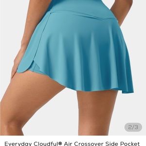 Halara 2:1 crossover skirt with shorts underneath with pocket. Vibrant color